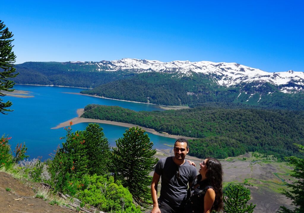 travel couple in Chile in the mountains - about us page